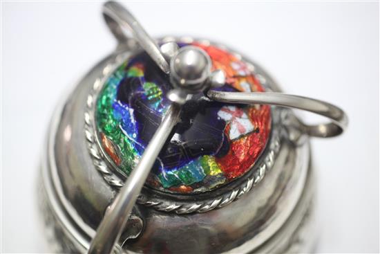 An Edwardian Arts & Crafts planished silver and enamel circular box and cover by Ramsden and Carr, height 11.5cm.
